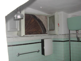 Open up the old bathroom arch and swap rooms with the old kitchen!